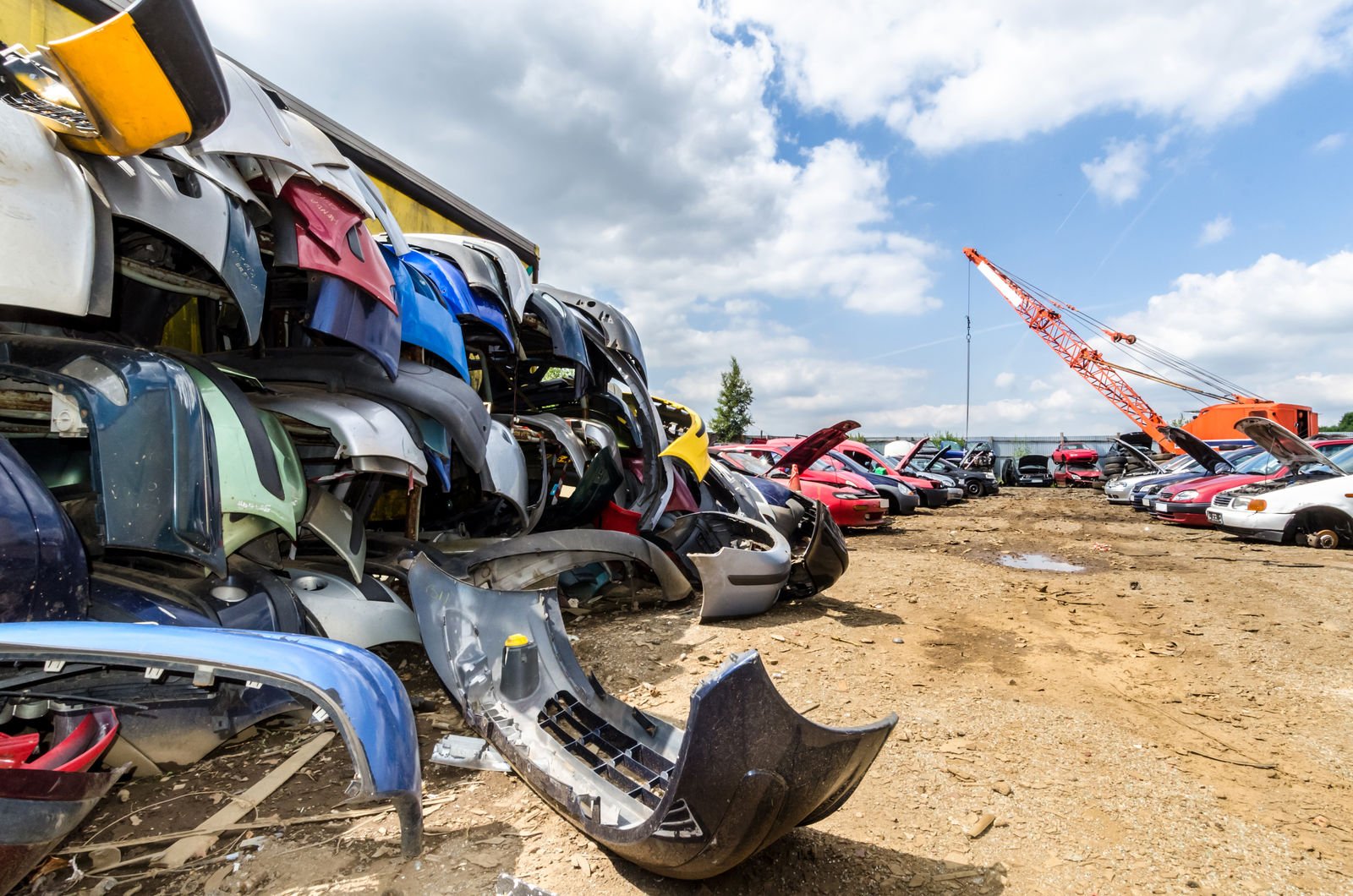 Scrap car parts in a junkyard