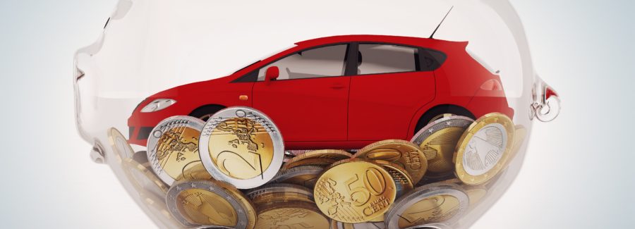 Transparent piggybank with coins and red car