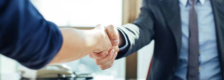 Close up of business handshake in the office